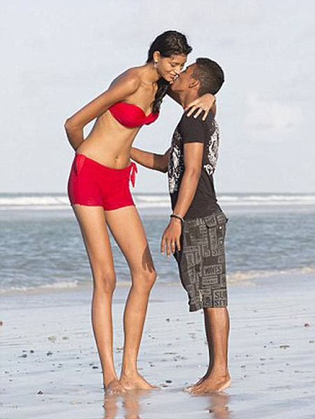 Teen Girl Towers Over Her Lover